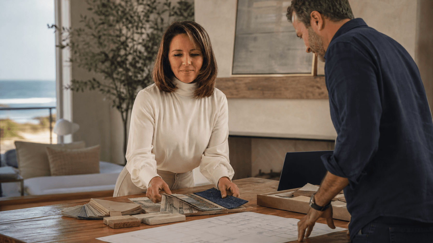 Dana Townsend reviewing vacation-rental design materials with a project partner